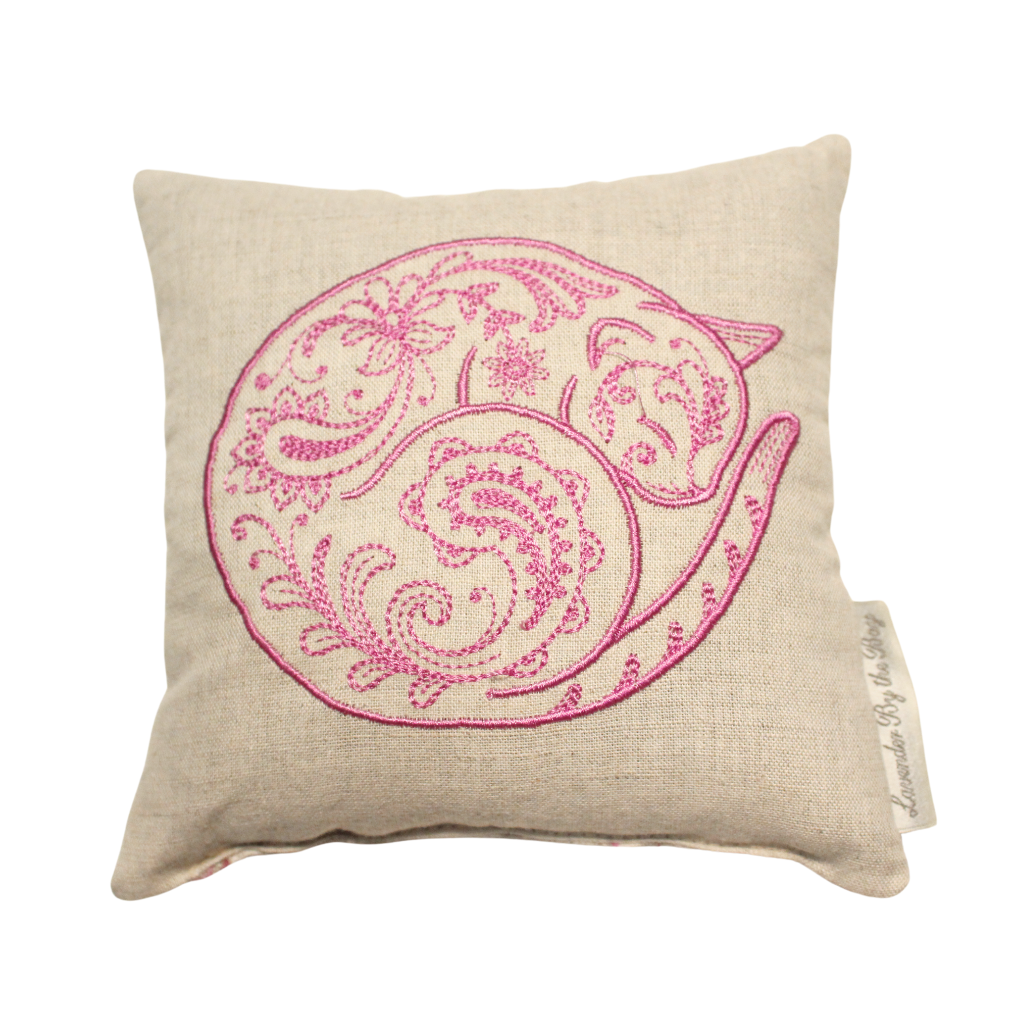 An embroidered cat sachet, featuring a pink curled cat design on a soft, white pillow. The sachet is filled with lavender scent.