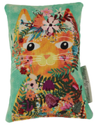 Cat on Green lavender scented pillow on white background