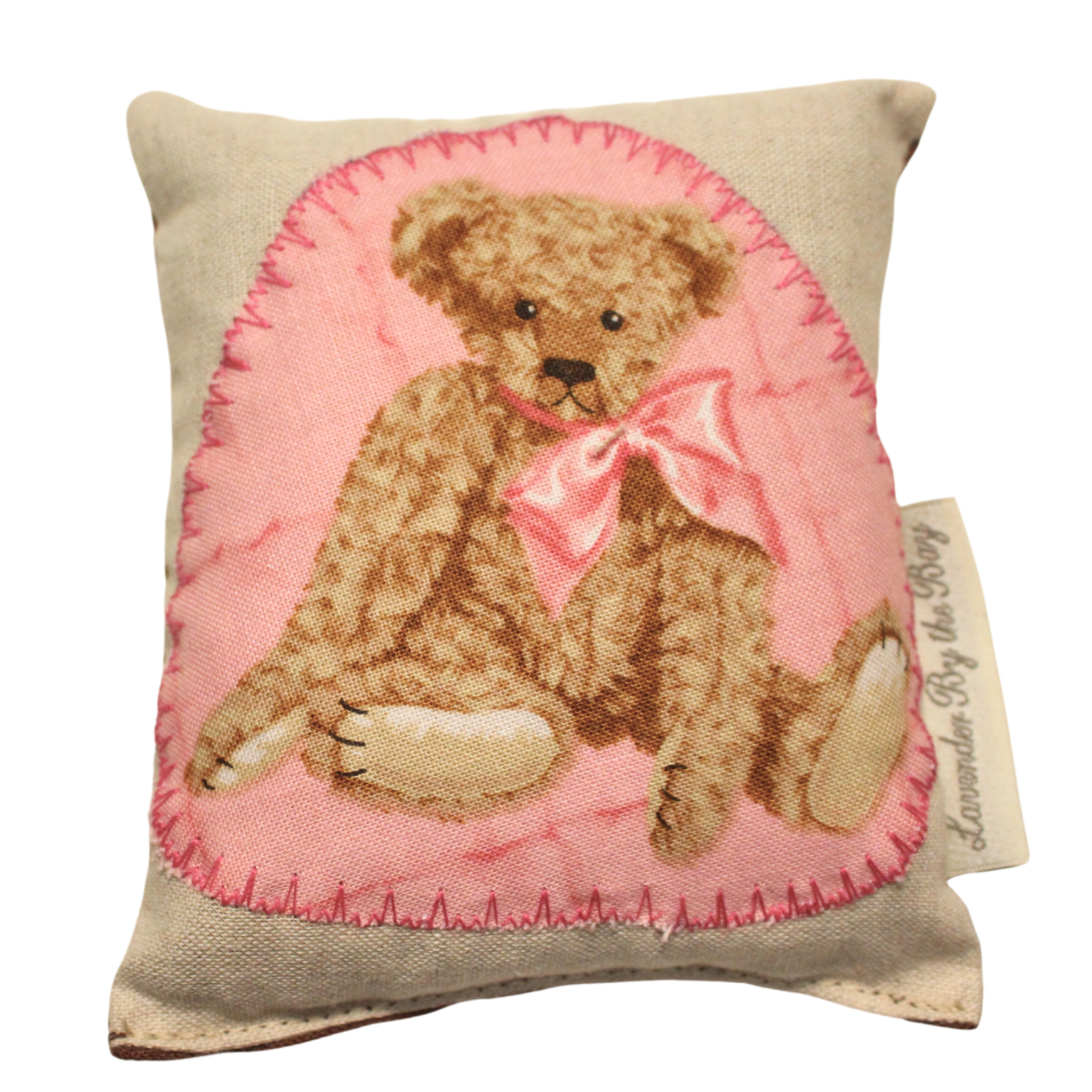 one of our handmade lavender sachets featuring a stting teddy bear with a pink bow