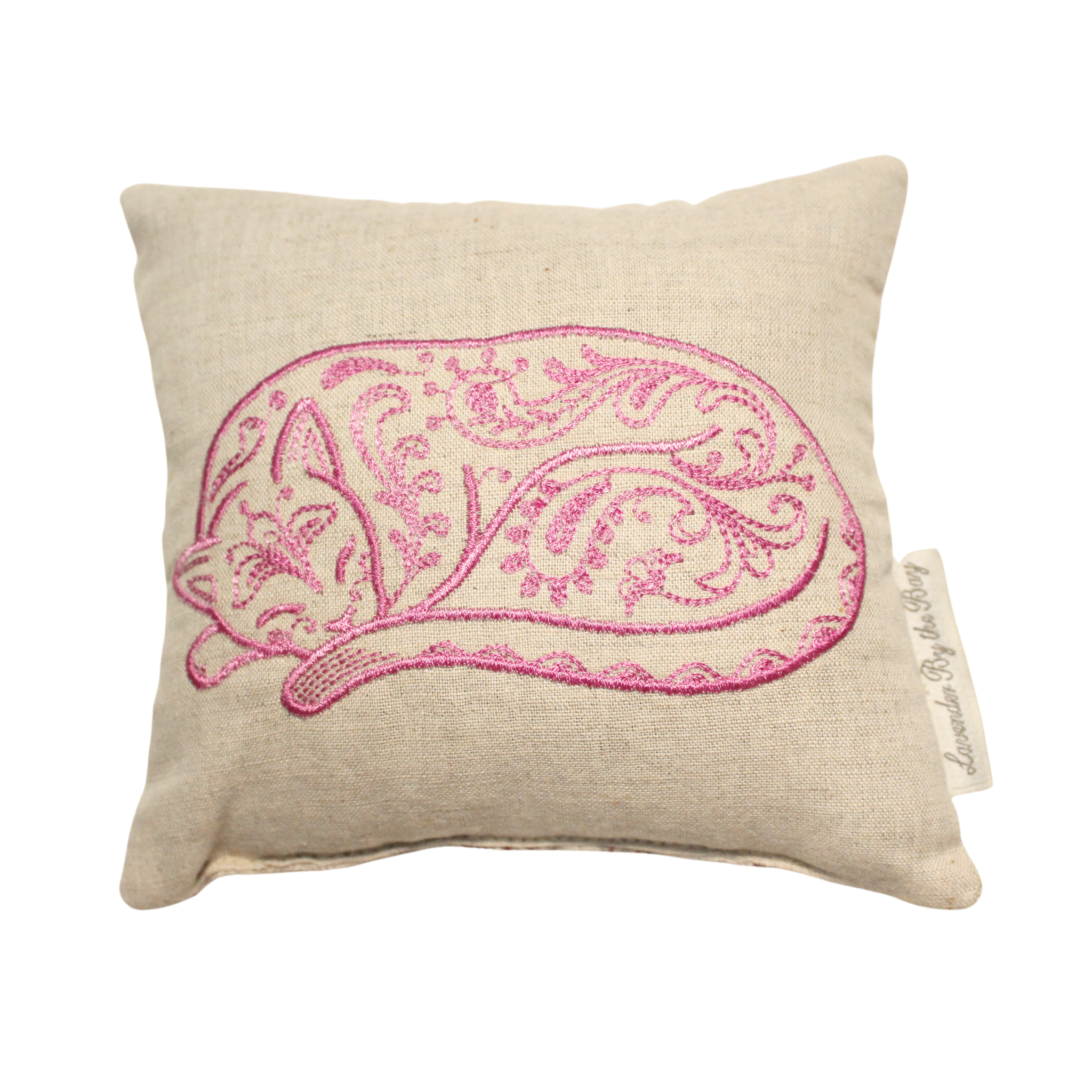 An embroidered aromatherapy sachet, featuring a sleeping pink cat design on a soft, white pillow. The sachet is filled with fragrant lavender.