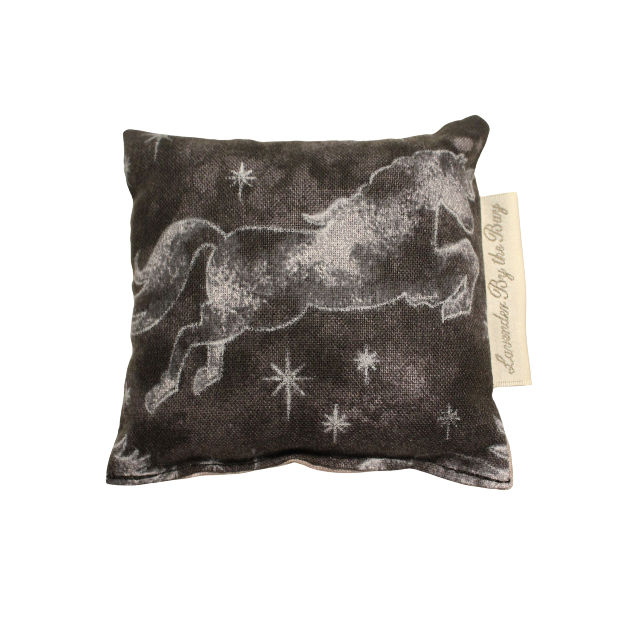A black scent sachet with a white embroidered unicorn design against a starry night sky