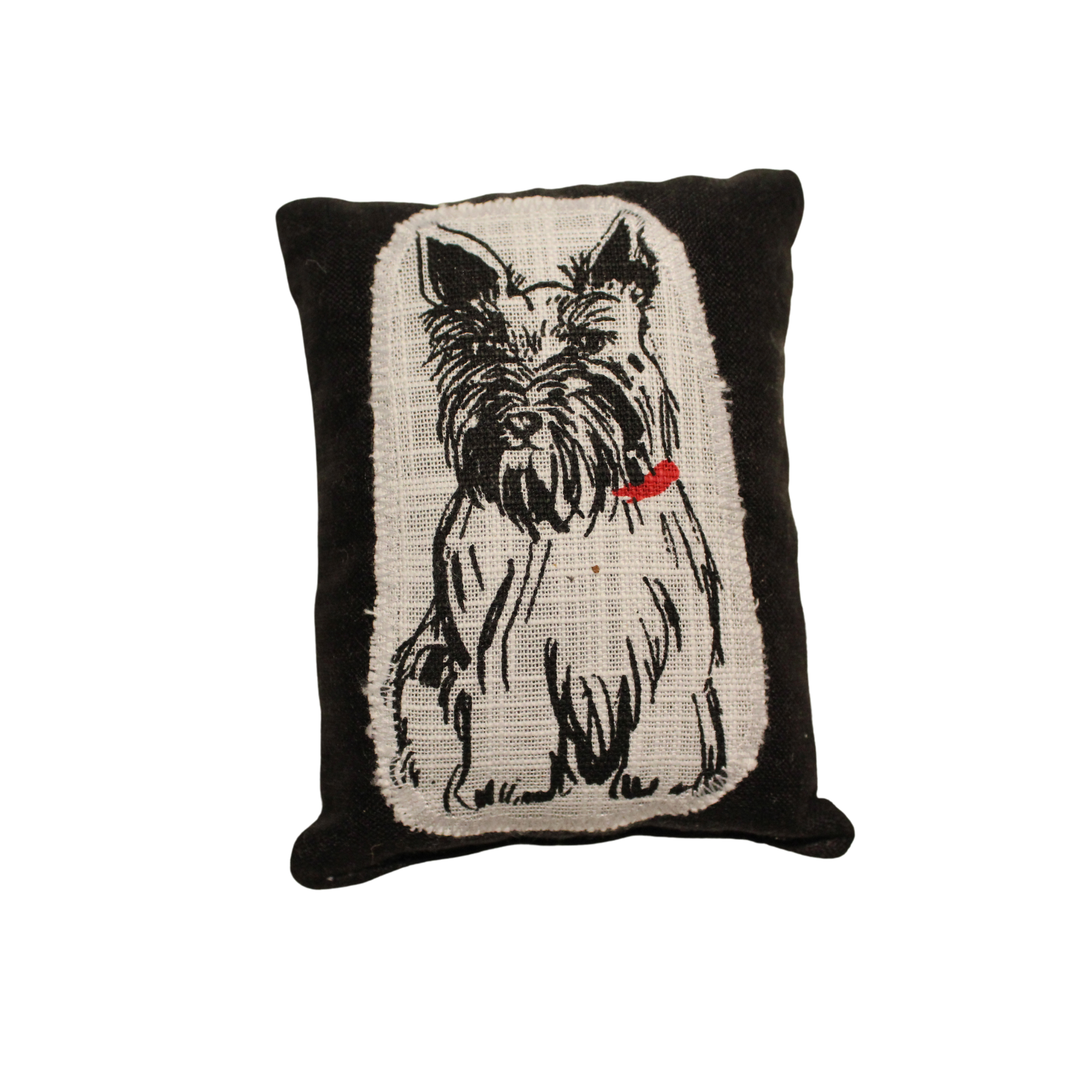 A black lavender sachet for moths
with an embroidered image of a Scottish Terrier.