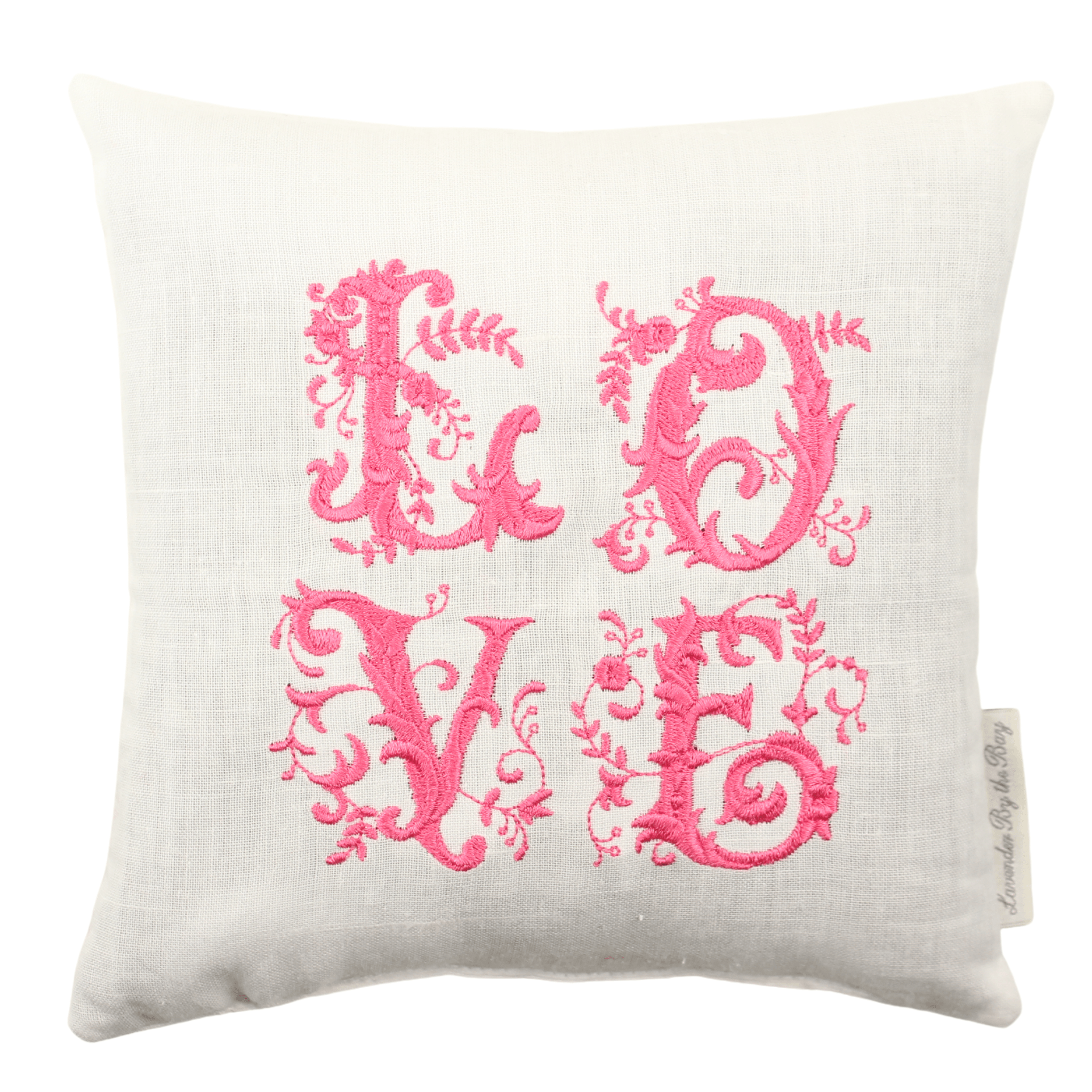 A fragrant sachet packet featuring the word 'LOVE' embroidered in pink on a soft, white pillow.
