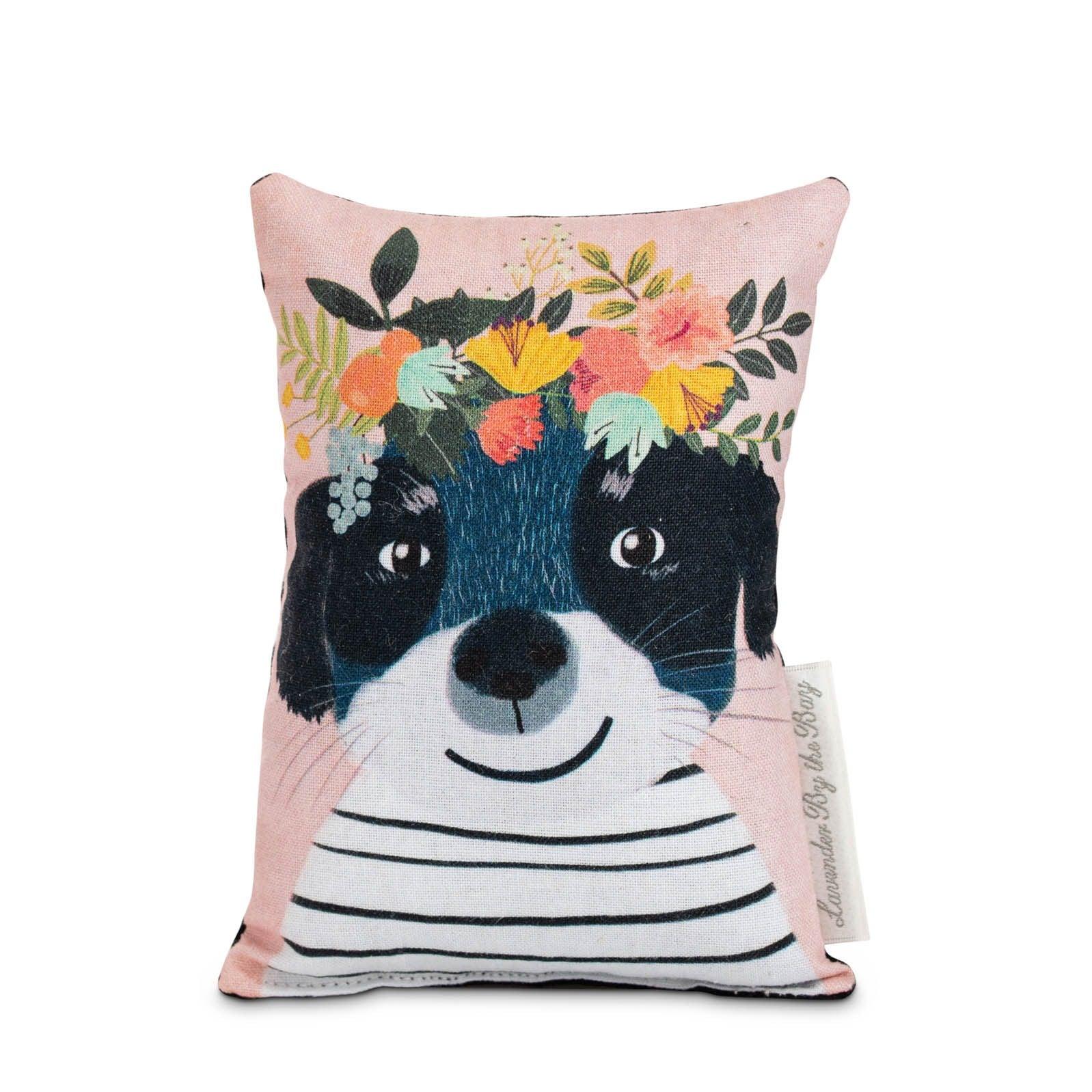 Black dog with striped sweater sachet bag on white background