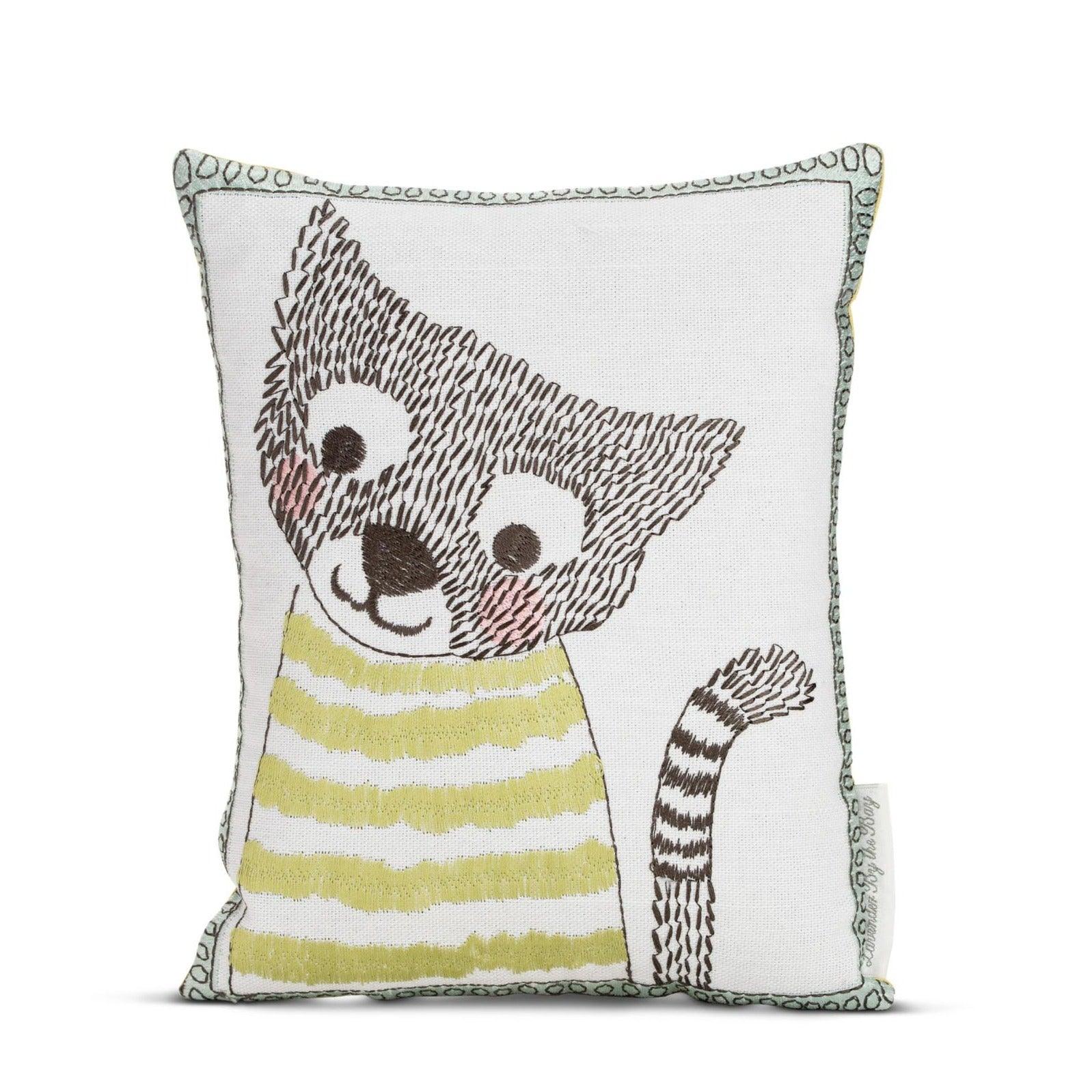 A square sachet birthday gift with an embroidered raccoon design. The raccoon is wearing a striped shirt and has a playful expression