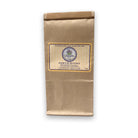 A brown paper bag with a label for "Herbes de Provence," a blend of Fragrant Herbes. The label includes the brand name "Lavender by the Bay" and LBTB website address