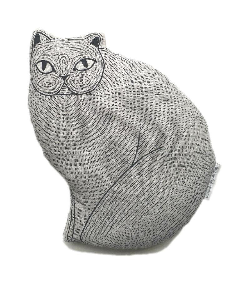A gray cat shaped cushion with a detailed, dotted pattern.