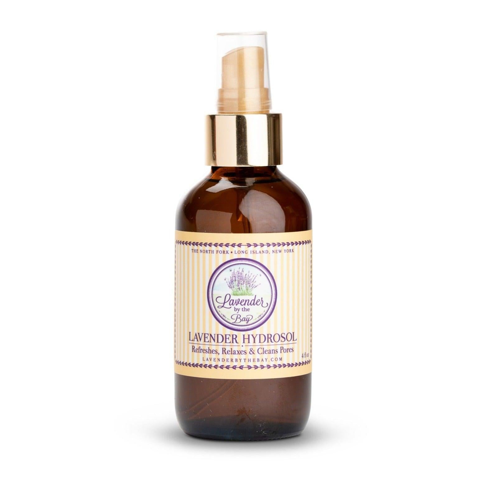 Lavender hydrosol sprayer bottle with Lavender By The Bay logo standing on white background