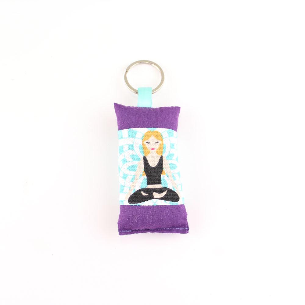 Blonde yoga girl design featuring on embroidered keychain tag sachet on white backgroung