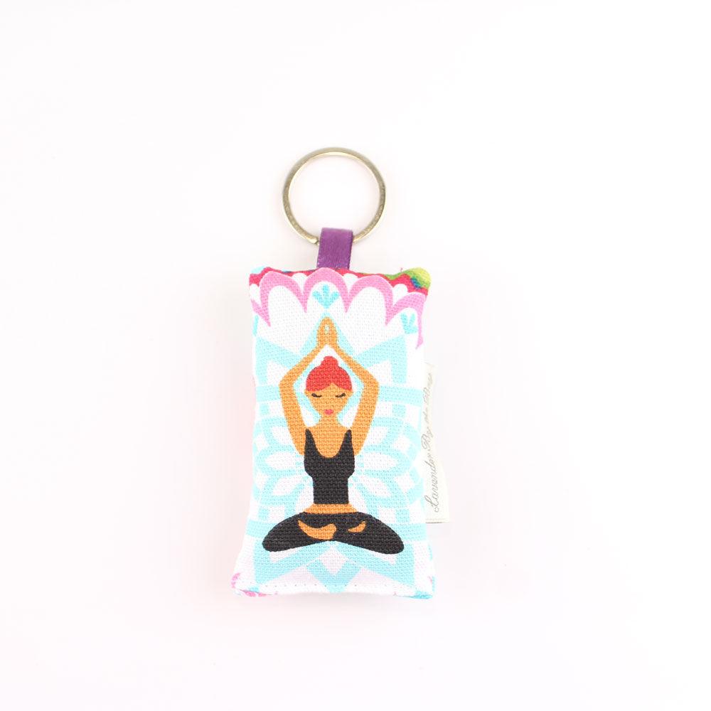 Red haired yoga girl design featuring on embroidered scented  lavender keychain on white background