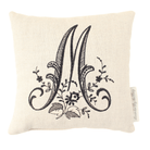 Monogrammed bed reading pillow with black letter M on white background