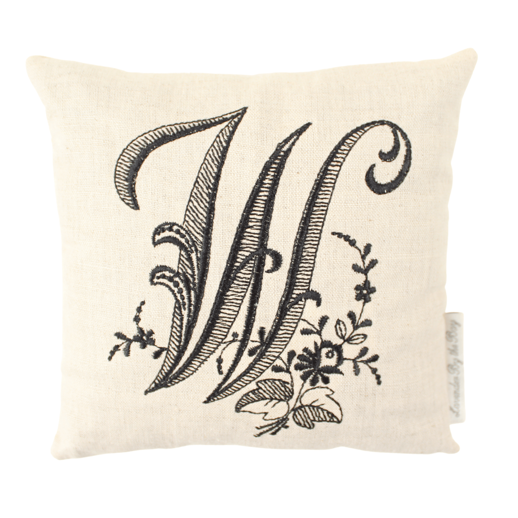 lavender pillow with black W letter on white background