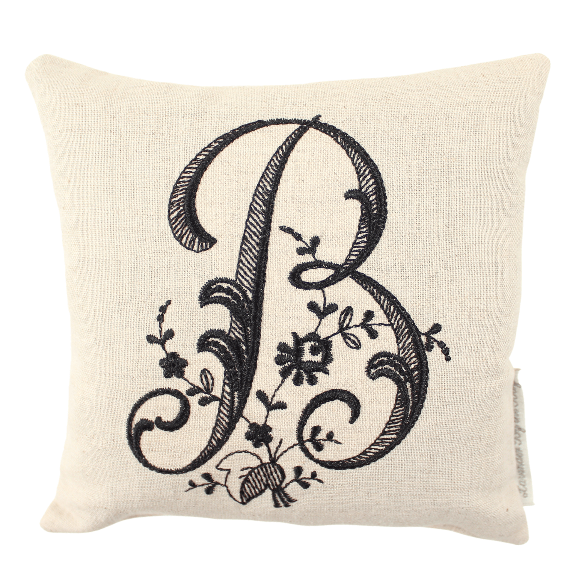 monogrammed throw pillow with black letter B on white background