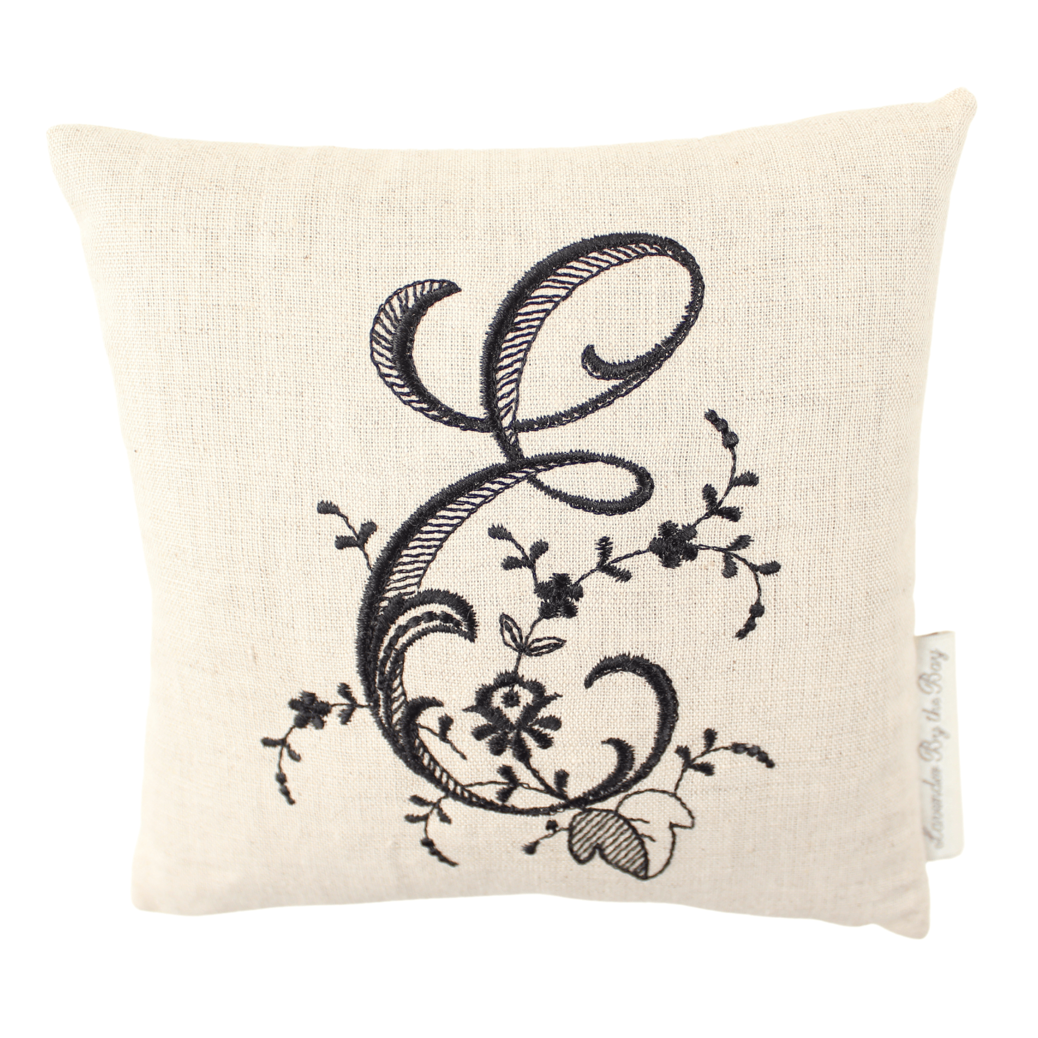 Monogramed pillow with black letter E on white background