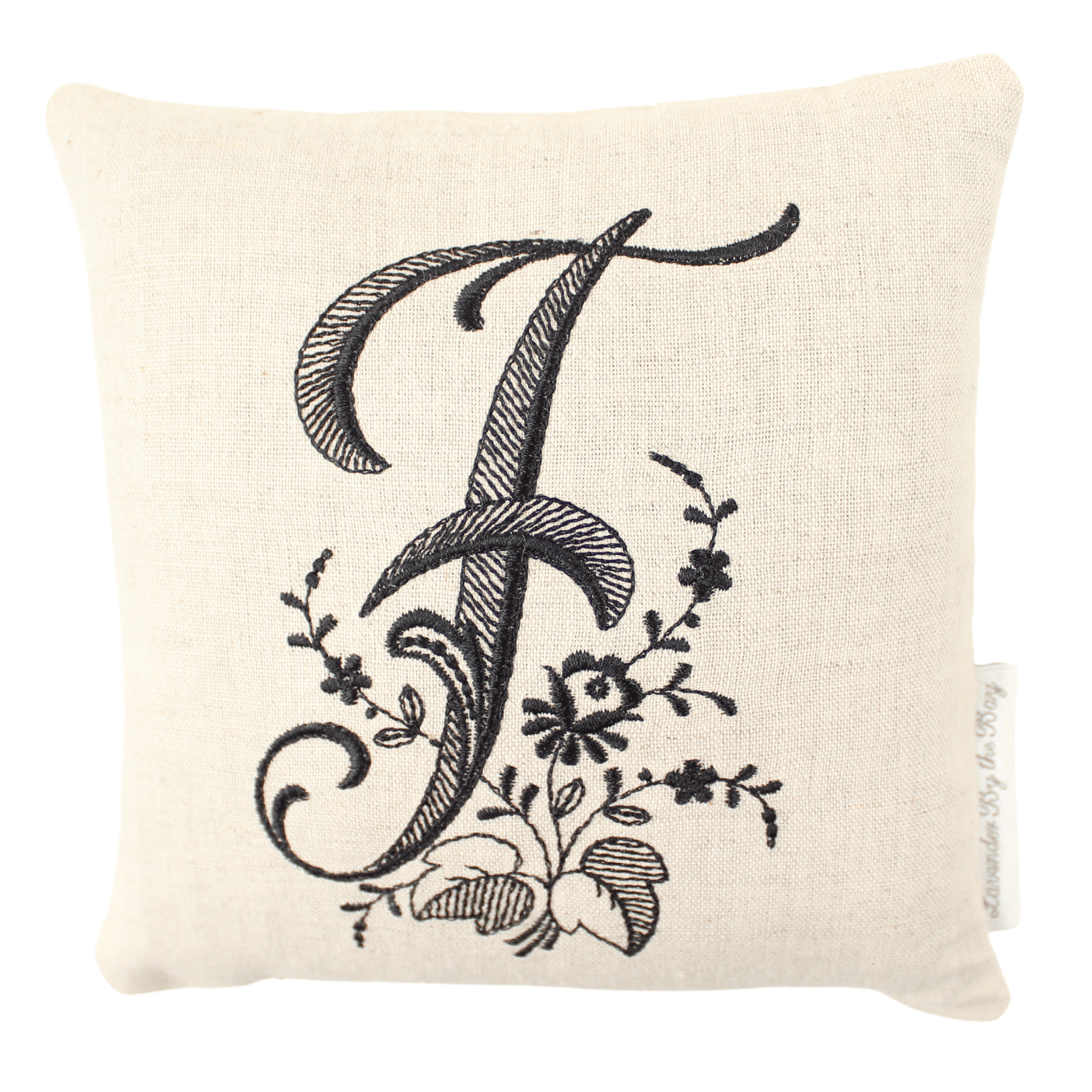 Monogrammed lavender pillow with black letter F on white background