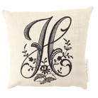 Monogram bed pillow with black letter H on white background