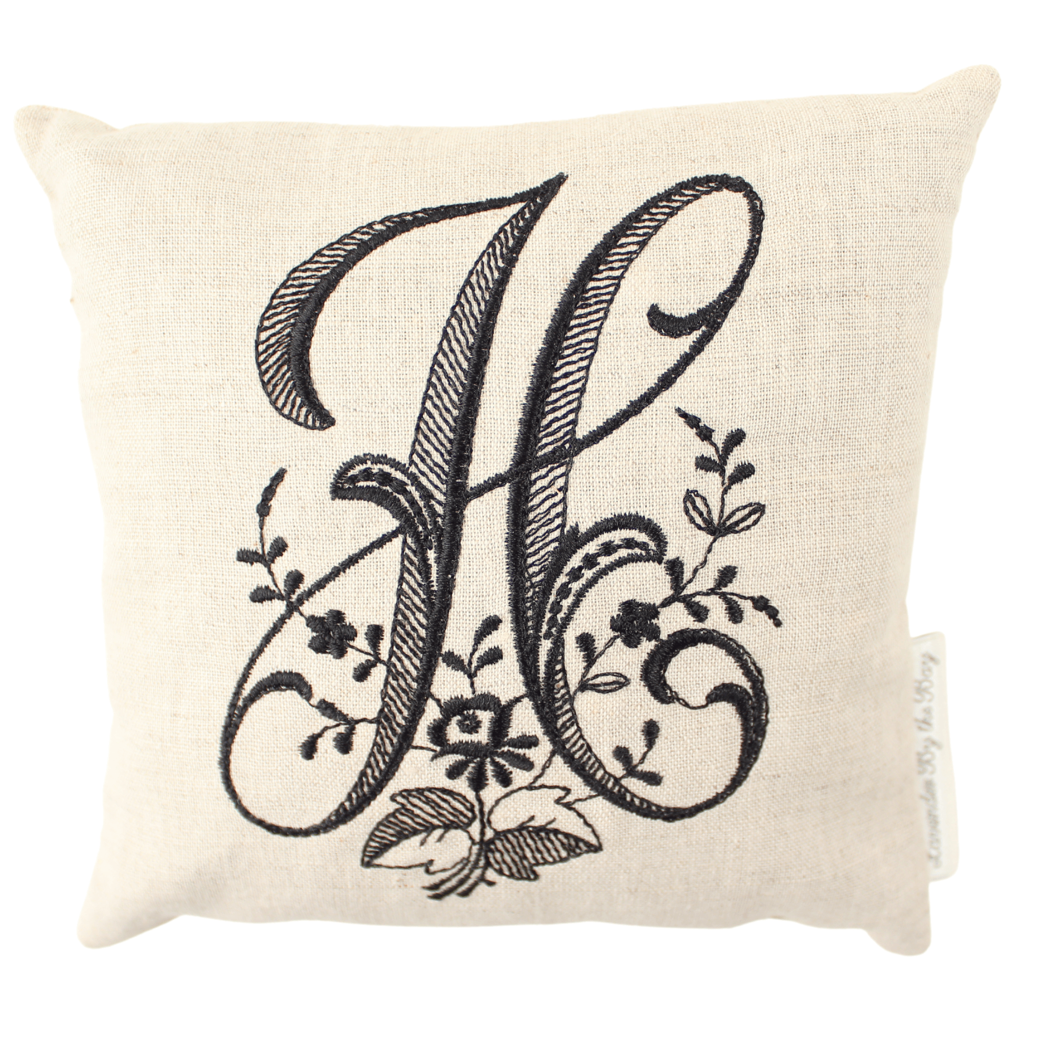 Monogram bed pillow with black letter H on white background