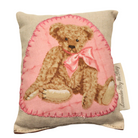 one of our handmade lavender sachets featuring a stting teddy bear with a pink bow 